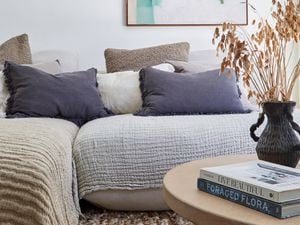 A lounge covered in textured throws and pillows creating a healthy home