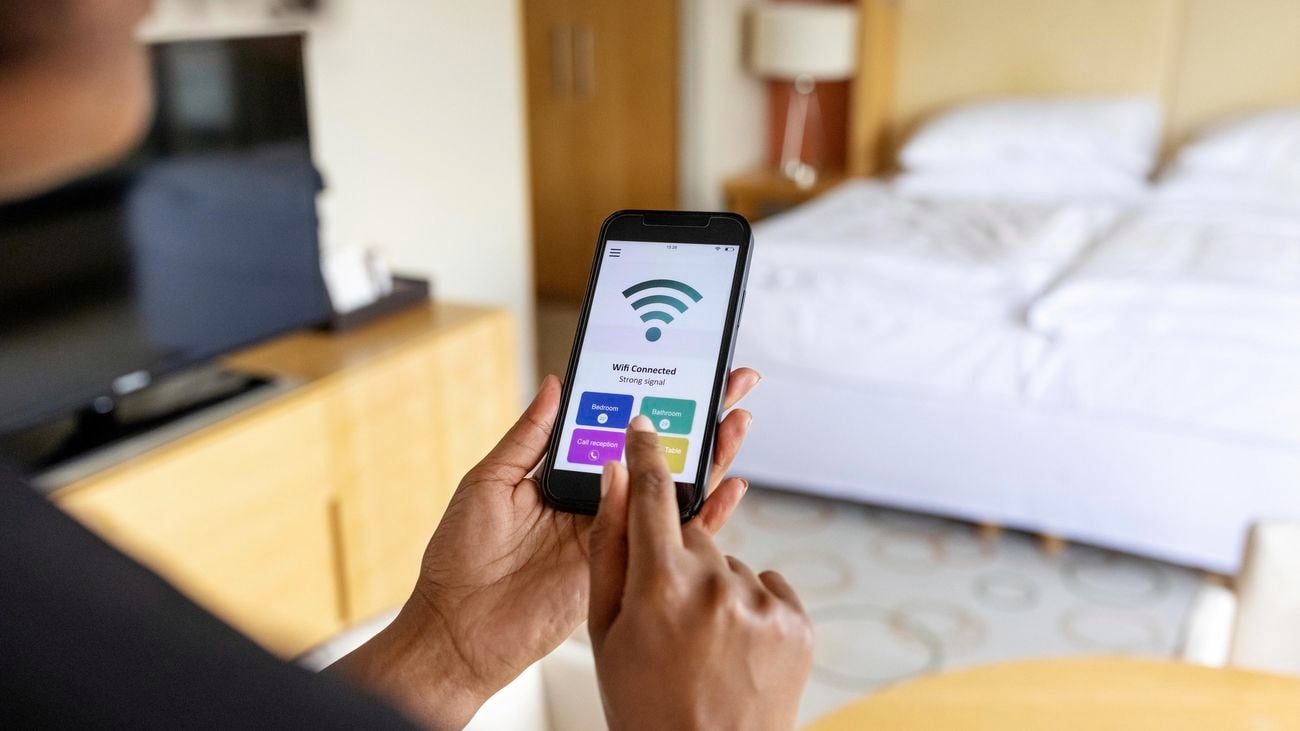 Person adjusting wifi on smartphone.