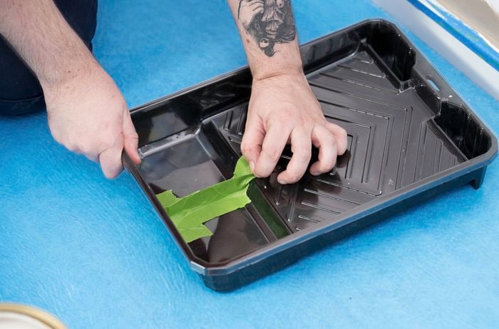 Set up a paint tray by creating divider