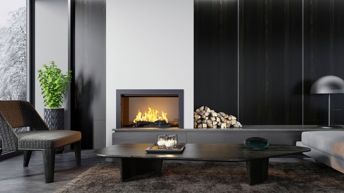 Modern living area with couch, coffee table, kindling and fireplace.