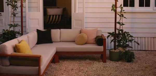Outdoor area with fairy lighting over outdoor couch 
