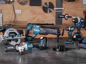 A complete Makita six piece combo kit, including angle grinder, circular saw, various power drills and more