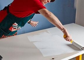 Person painting a door.