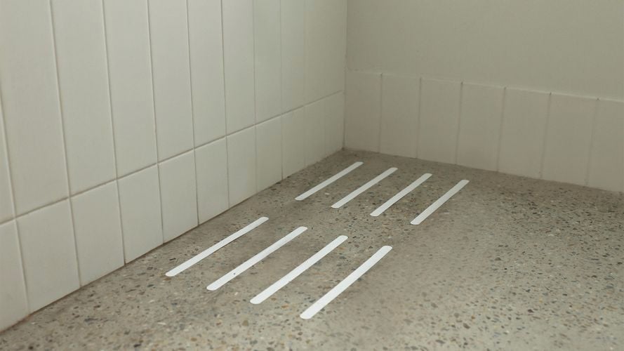 Tread adhesive in bathroom