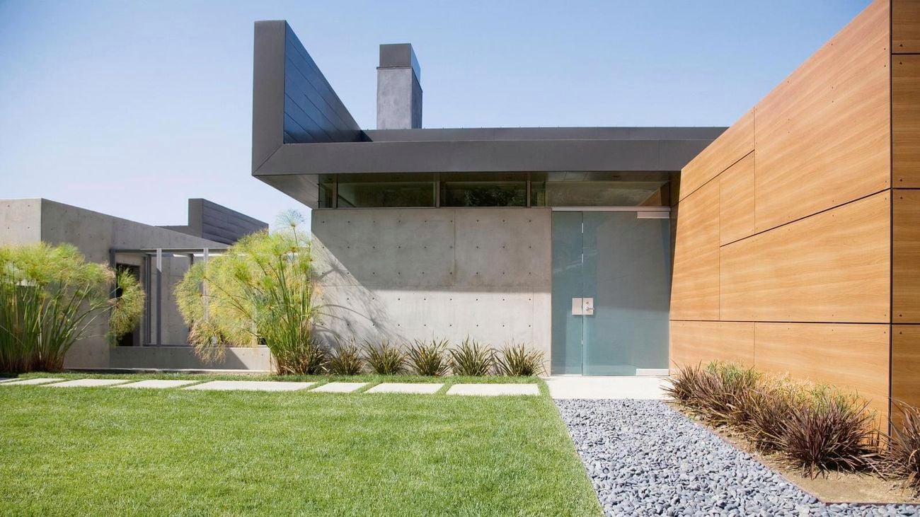 Modern style housing with a well maintained lawn