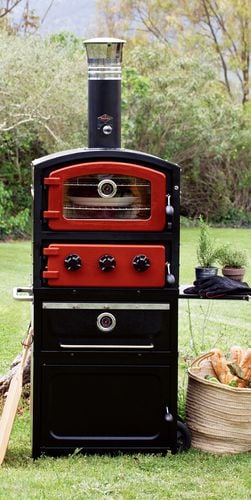A plate of food being cooked in an outdoor stove
