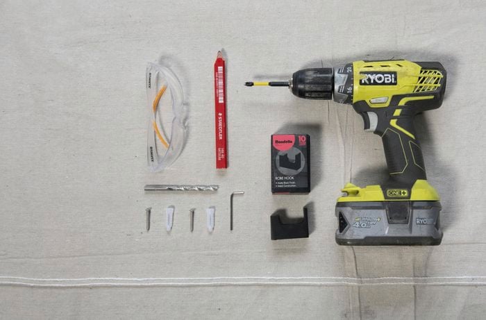 All the tools required to put a hook in a wall