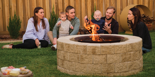 firepit with a family around