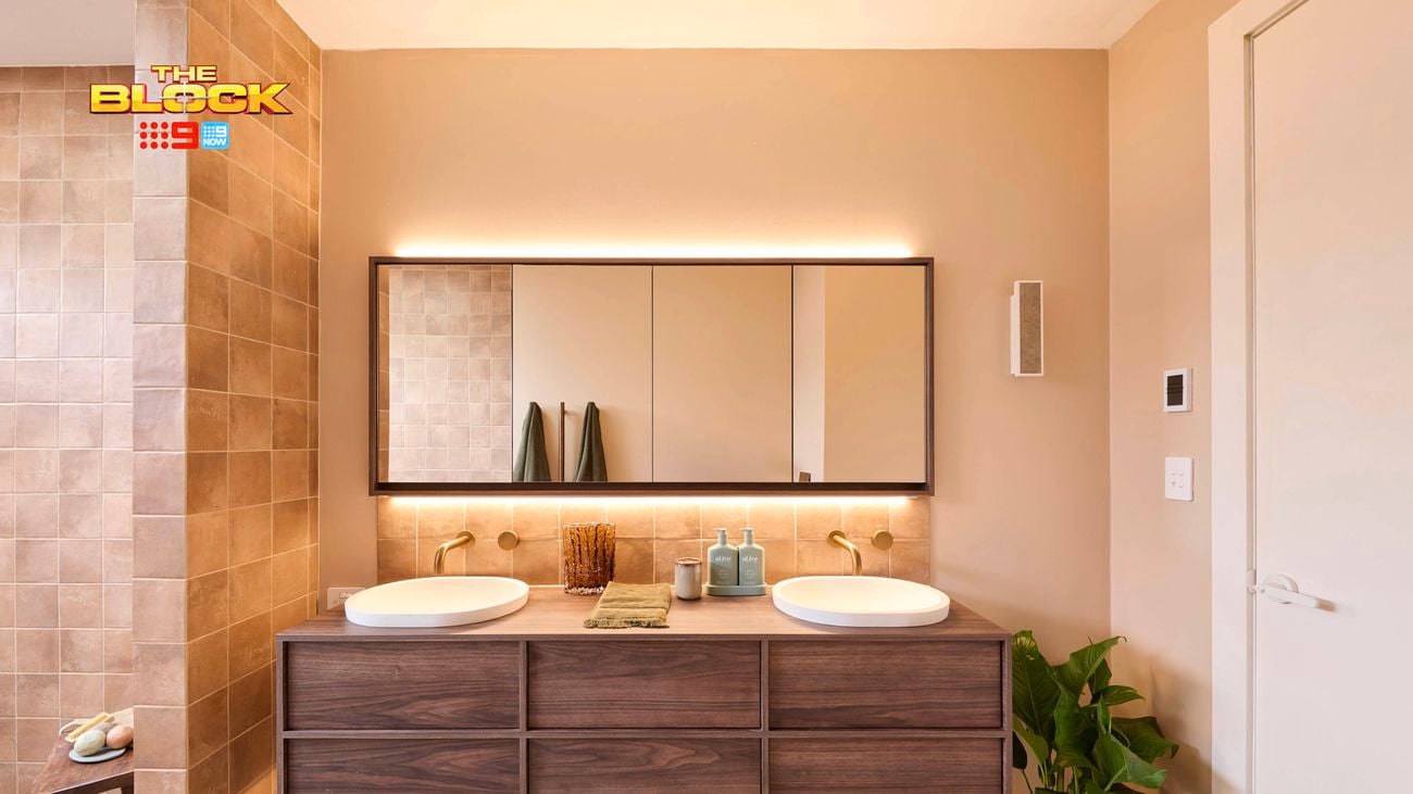 Natural coloured brown bathroom with timber vanity, 2 white round basins and shower