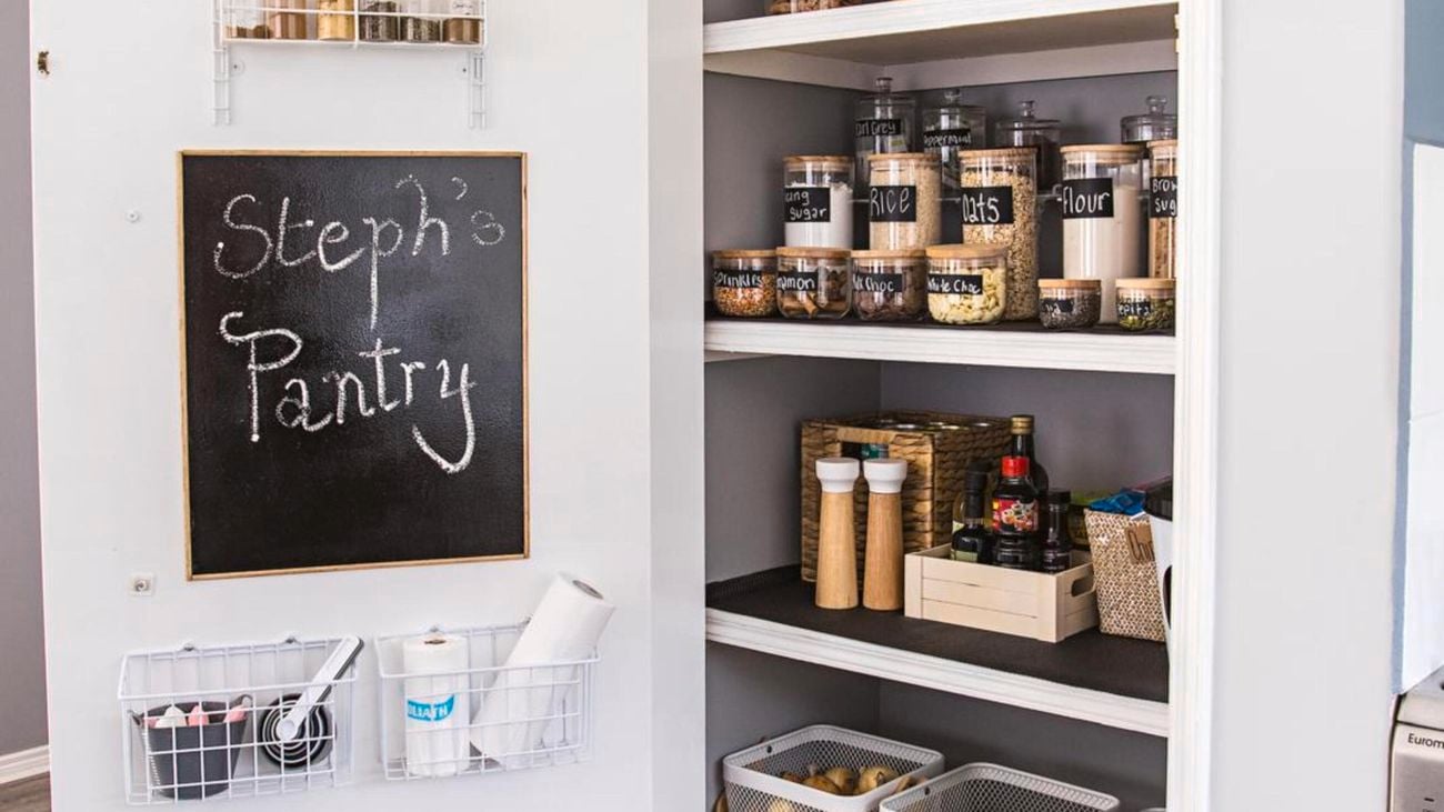Neat pantry containing glass jars with food