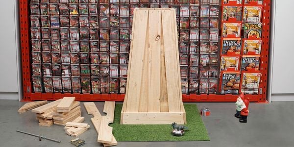 Timber pieced together to form a vertical box.
