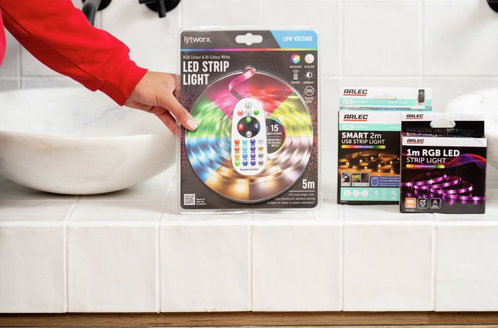 A range of LED strip light products is displayed on a bathroom vanity, highlighting different lengths, control options and features to help choose the right lighting solution. 