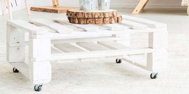 White pallet coffee table with wheels.