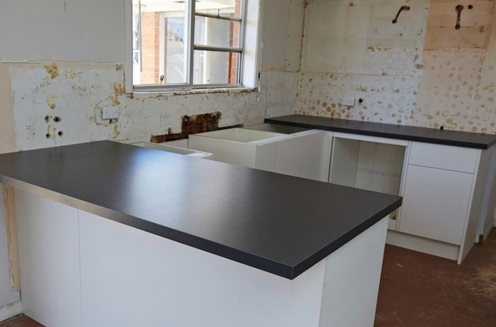Kitchen cabinets with installed benchtops