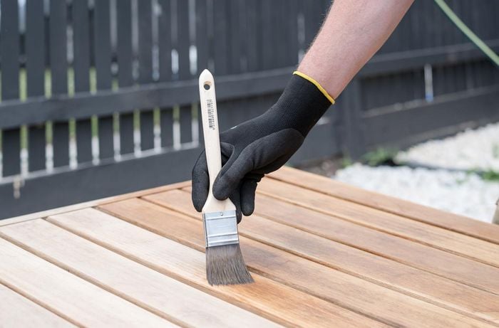 Using a paintbrush apply the furniture oil.