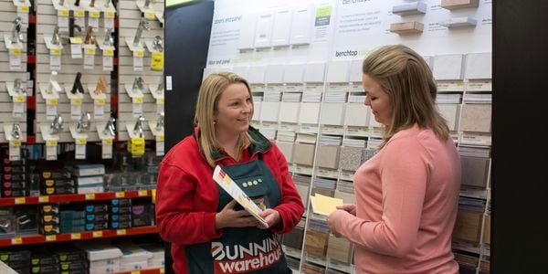 In-store kitchen consultant with customer