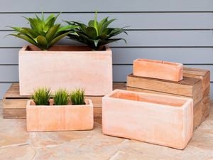 Grey and white kitchen with timber cabinets and rose gold pendant lights