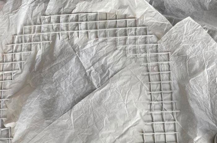 Drop sheet with a tin of spray paint