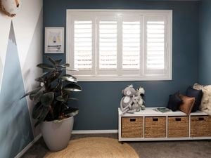 White plantation shutters in a house interior.