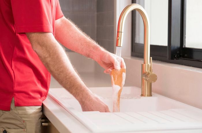 Tidy as you go by putting away ingredients, wiping spills, and rinsing utensils
