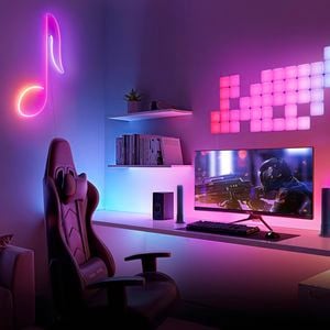 Indoor space with neon lighting, computer chair and  screens