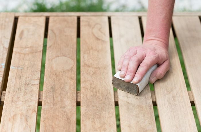 sanding back old timber table