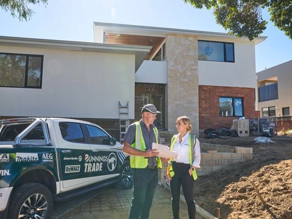 Bunnings trade ute with team member and customers