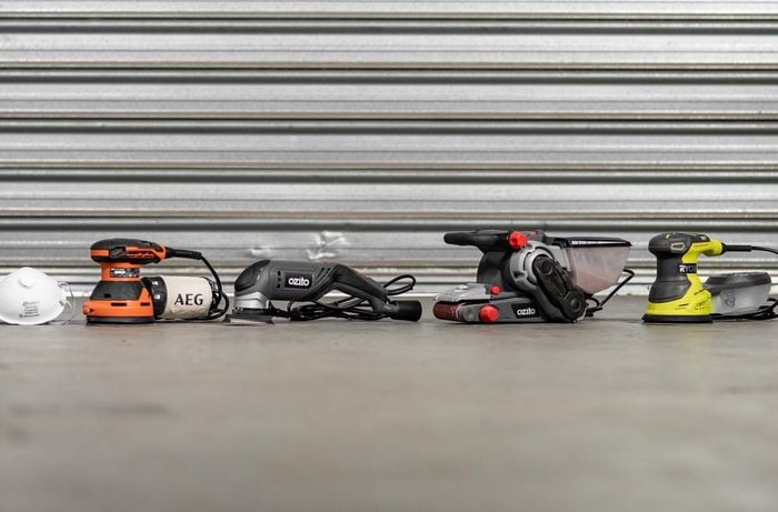 Assortment of sanders and power tools
