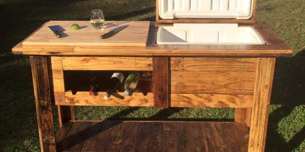 A DIY timber bar with wine storage rack and built-in cooler box outdoors