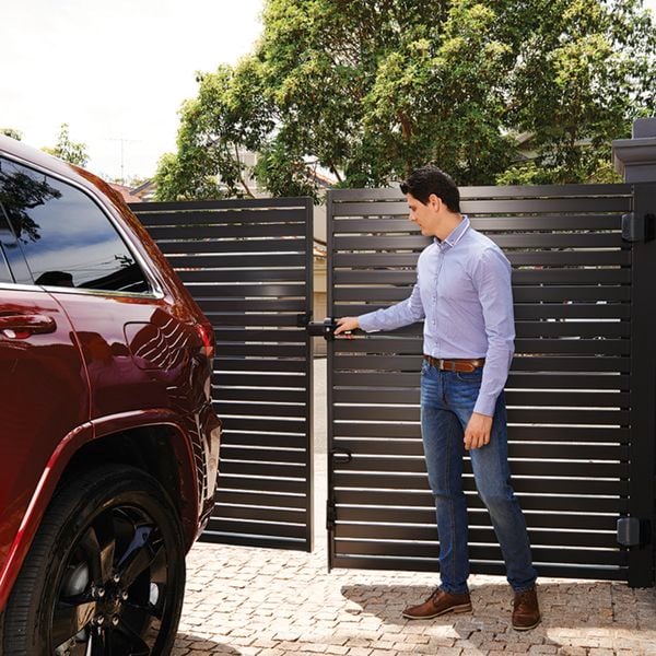 A man opening a D&D technologies gate.