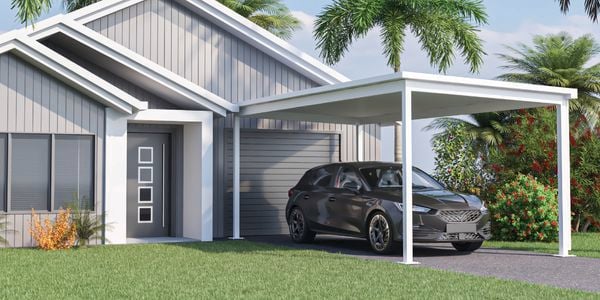 Image of Absco structures car port with car parked infront of house