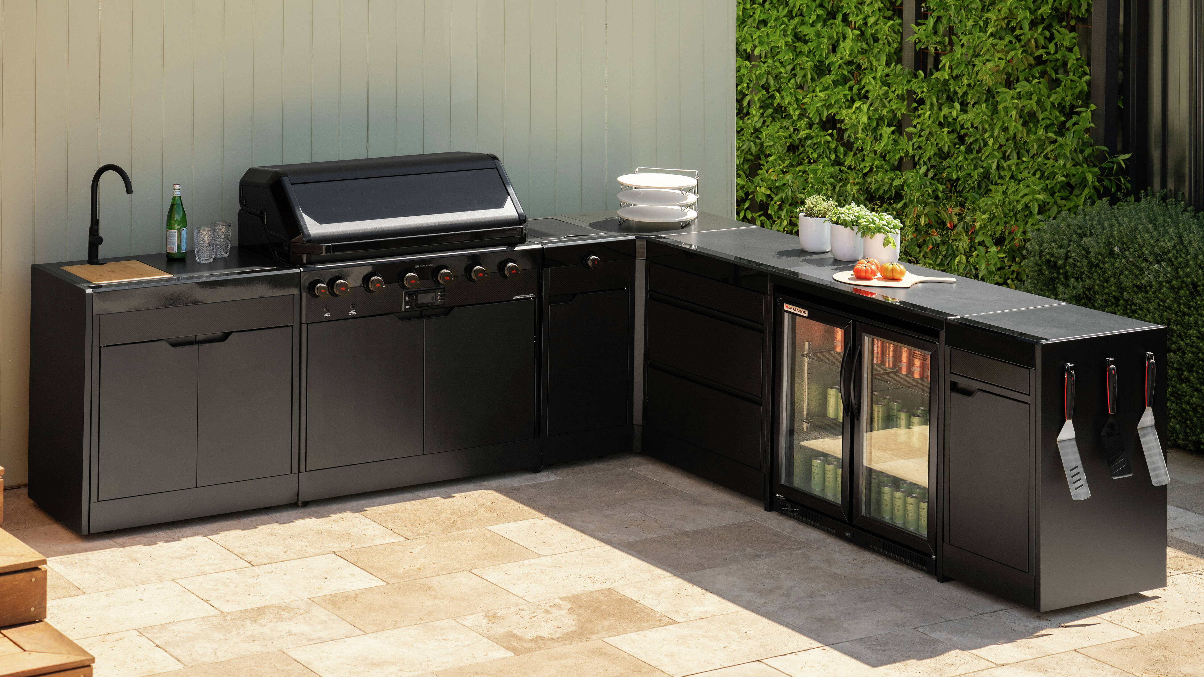  L-shaped Matador outdoor kitchen layout with BBQ and bar fridge