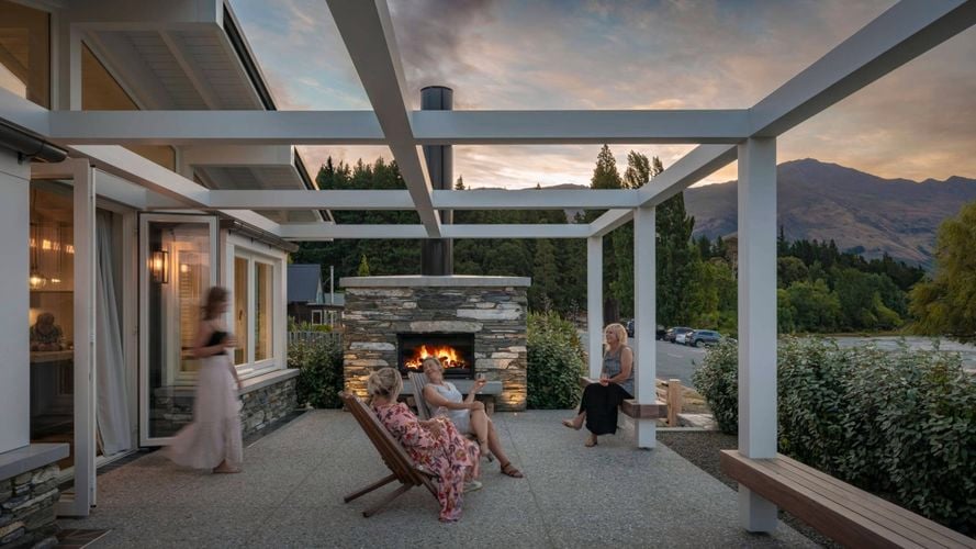 Women spending time beneath a pergola
