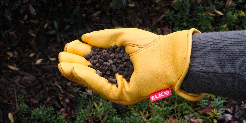 Comfort Gardener holding pellets