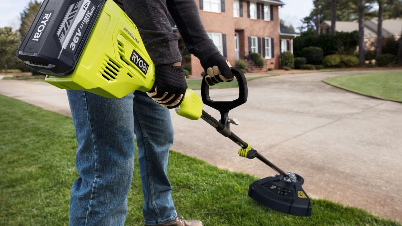 person  using a line trimmer