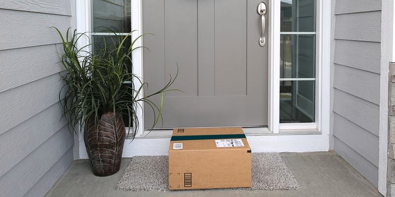 Parcel waiting on front door step.