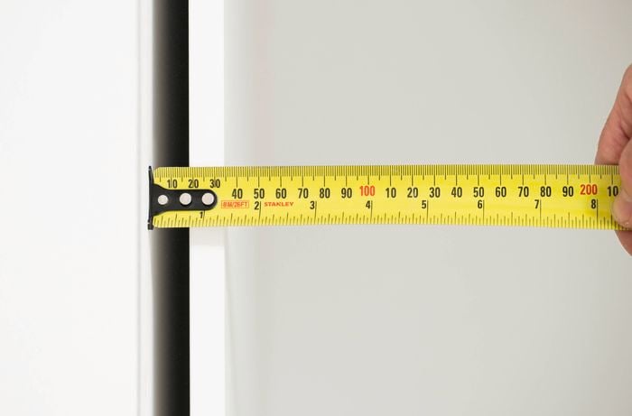 Check for an end panel allowance using a measuring tape