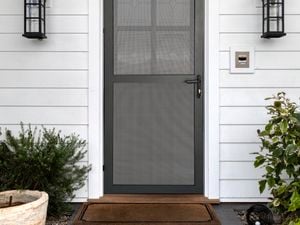 Close up of a house with a black security door