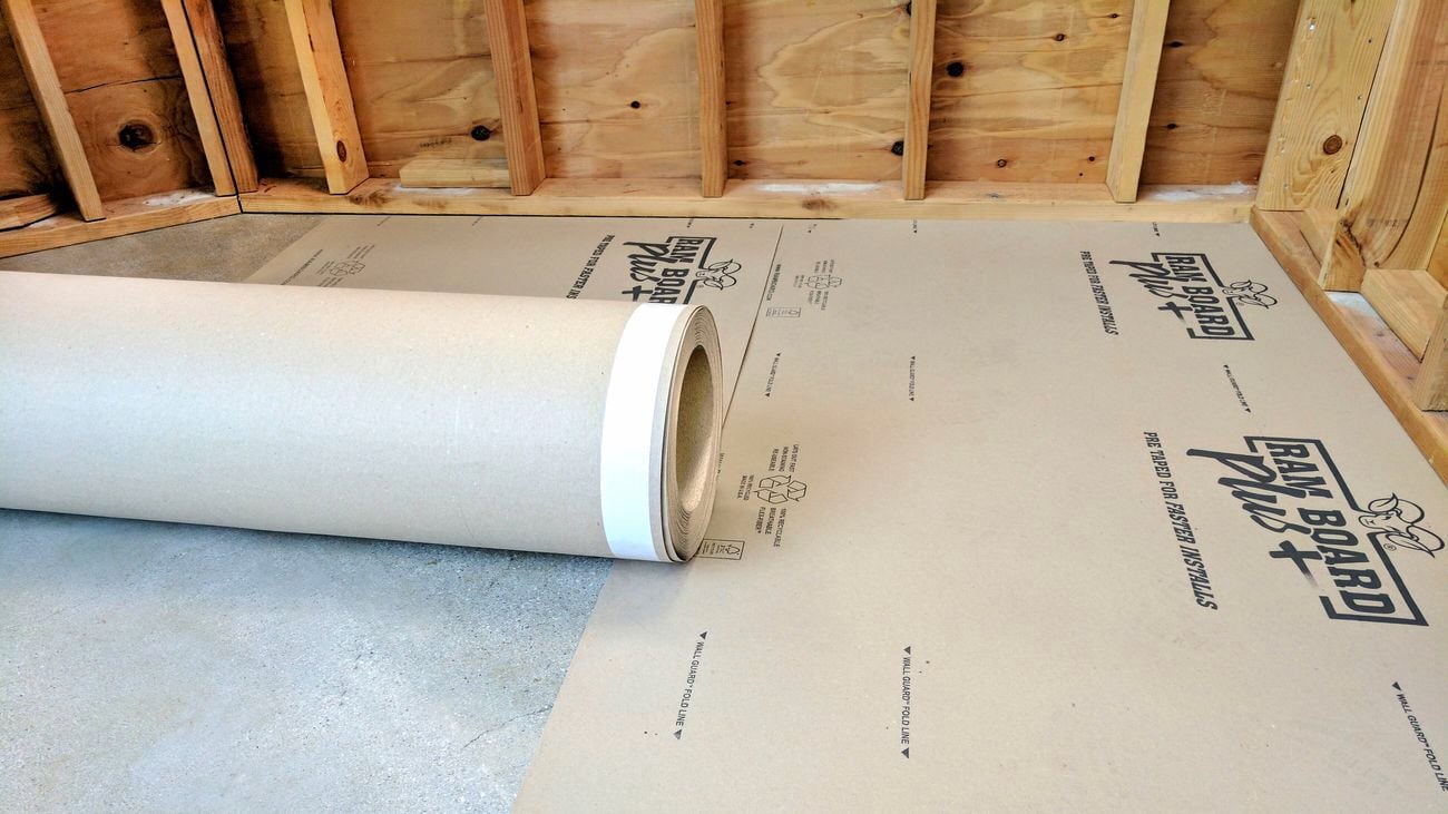 An image showing a roll of Ram Board Plus with some already laid on the floor