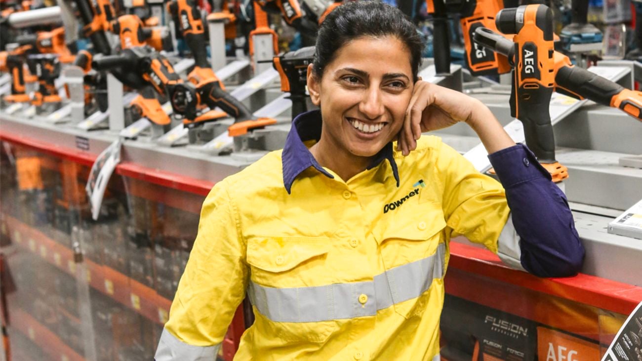 Women in construction advocate Faiza Nazar, a female electrical apprentice, dressed in hi vis workwear and full PPE