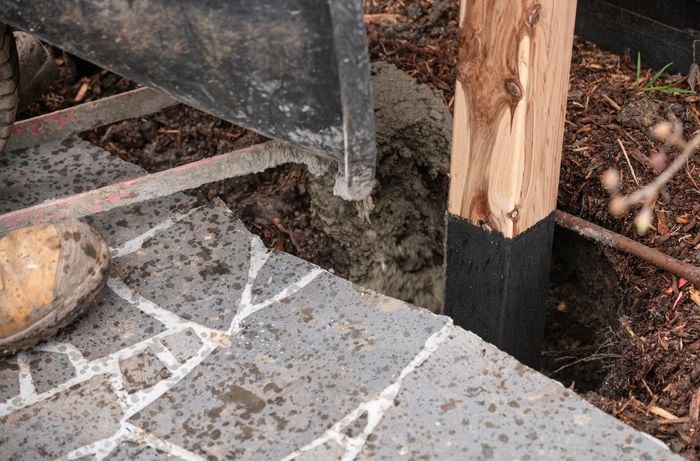 Concrete being poured into the hole