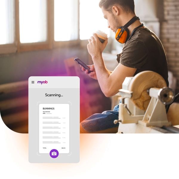 <p>Tradie drinking coffee and on the MYOB app.</p>