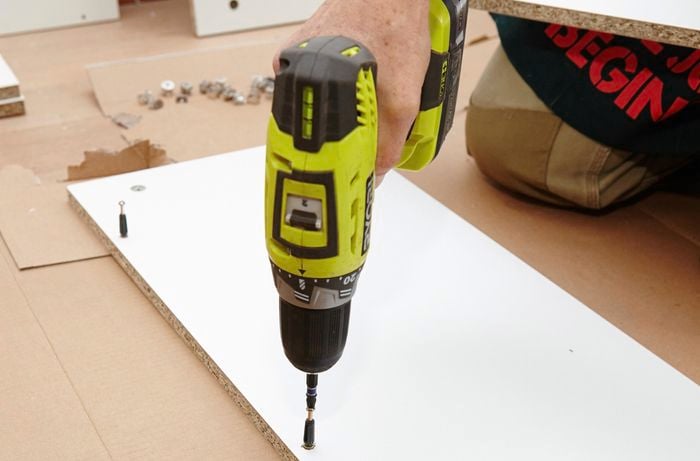 Securing the pins using a cordless drill