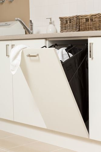 A pullout dishcloth hamper in a kitchen bench