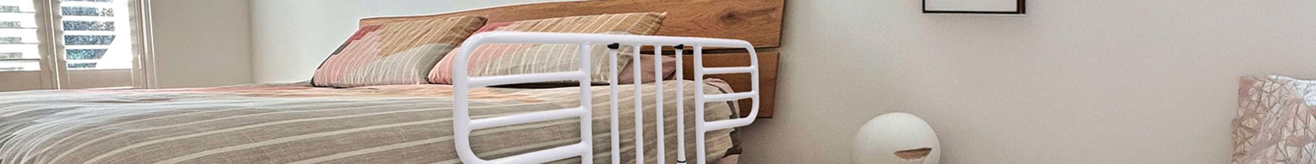 Header image of Q assist bed side railing attached to a bed