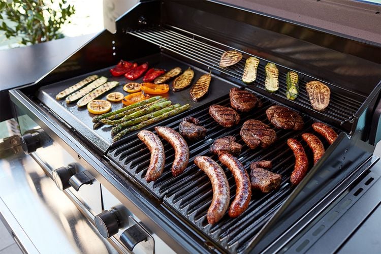 A barbecue with a variety of char grilled food
