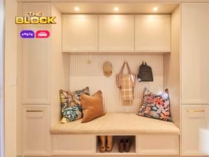 Mudroom nook from The Block with built-in bench, overhead cupboards, cushions, hooks, and shoe storage.