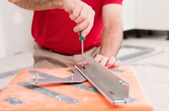 Remove the screws from the brackets
