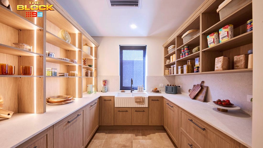 Butler’s pantry from The Block with timber cabinetry, open shelving, farmhouse sink, and stone benchtops.