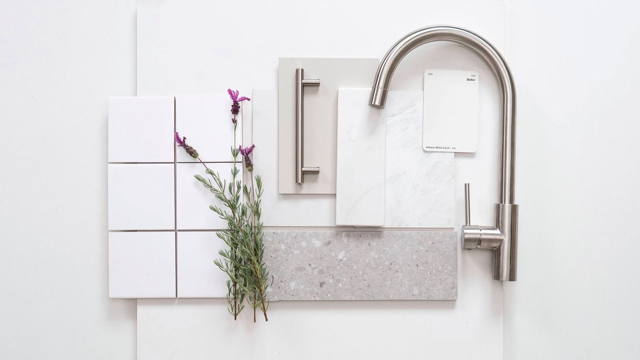 Soft Coastal kitchen flatlay with stainless tapware, white tiles, terrazzo, and lavender accents Image Description: A Soft Coastal kitchen flatlay featuring stainless steel tapware, white square tiles, terrazzo benchtop, soft neutrals, and sprigs of lavender for a fresh, natural touch